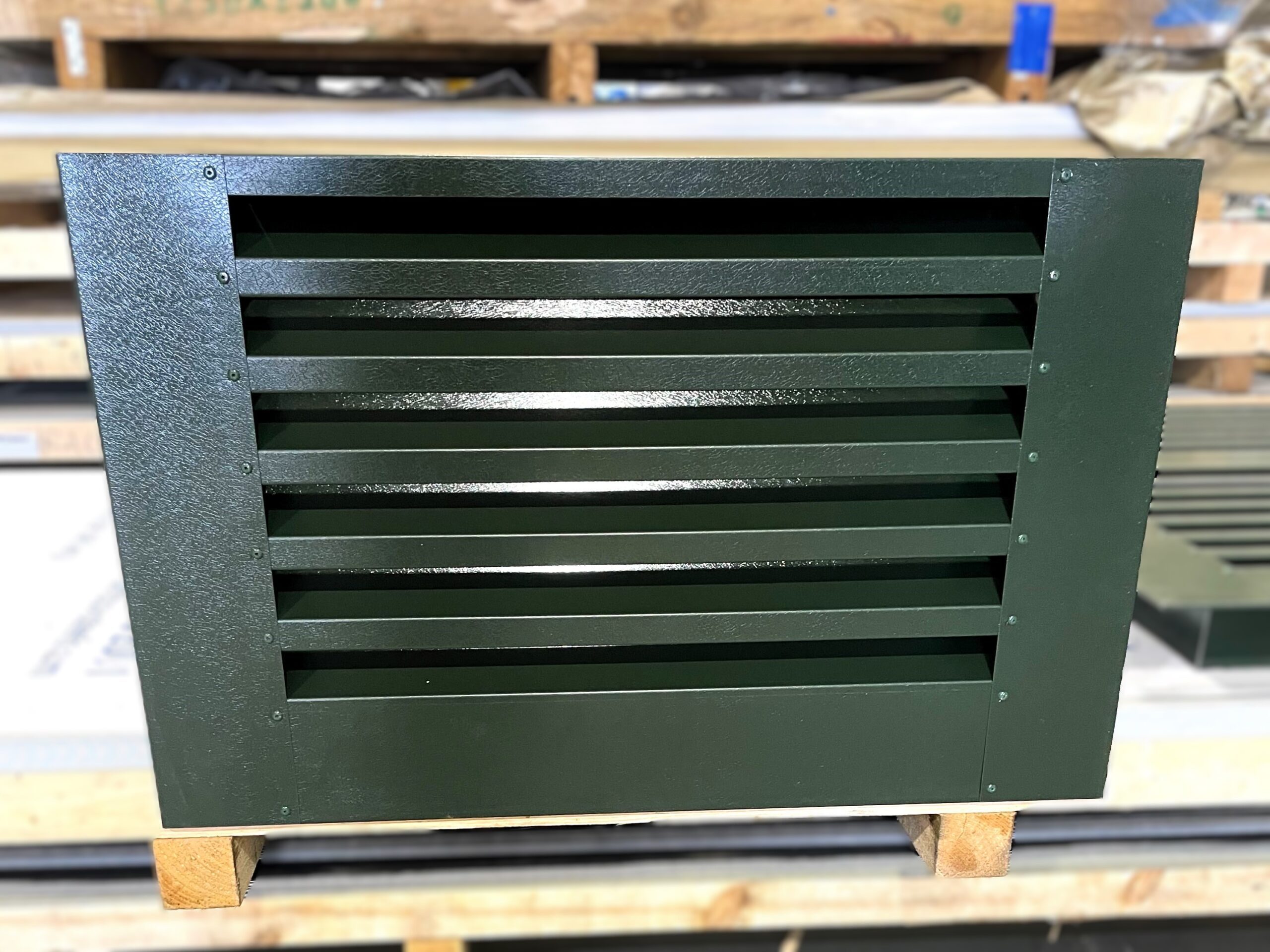 Custom green louvres fabricated by KR Group Scotland.