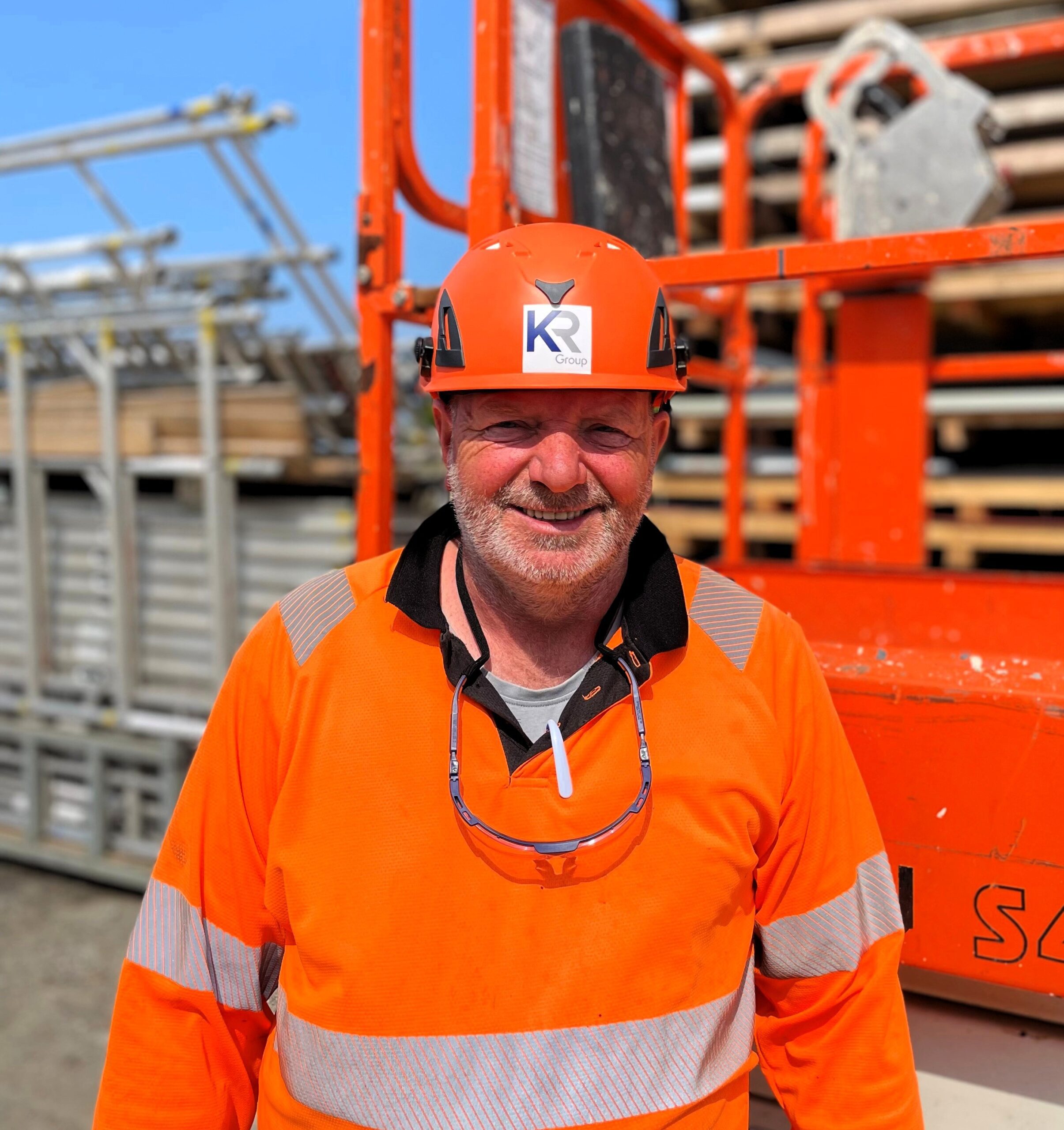 KR Group Scotland – Darrin Limond Standing in Yard Beside Scissorlift – Edited 2 KR Group Scotland - Darrin Limond Standing in Yard Beside Scissorlift - Edited 2