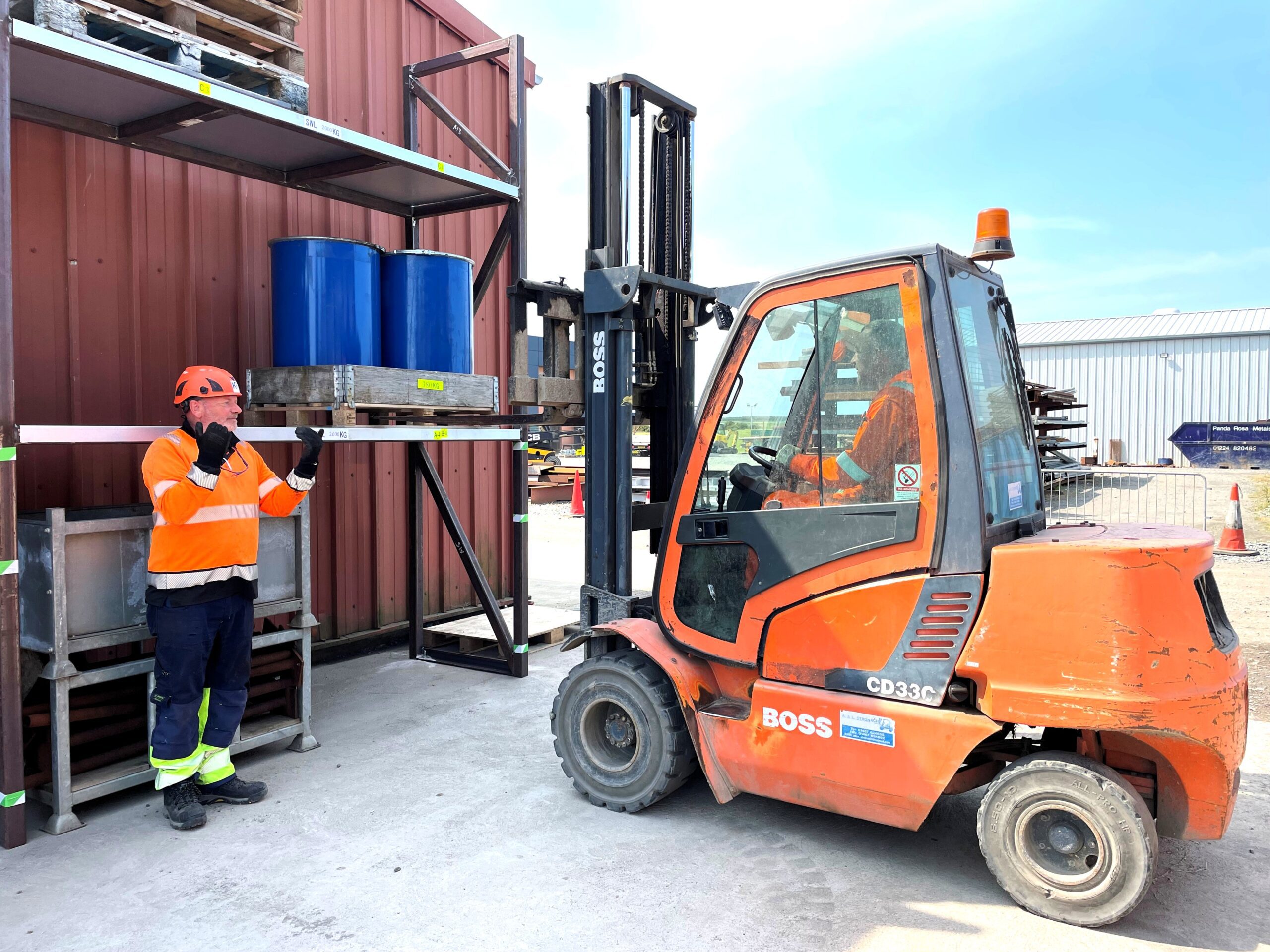 Darrin Limond of KR Group Scotland's KR SkillsHub directing training with a customer in the yard.