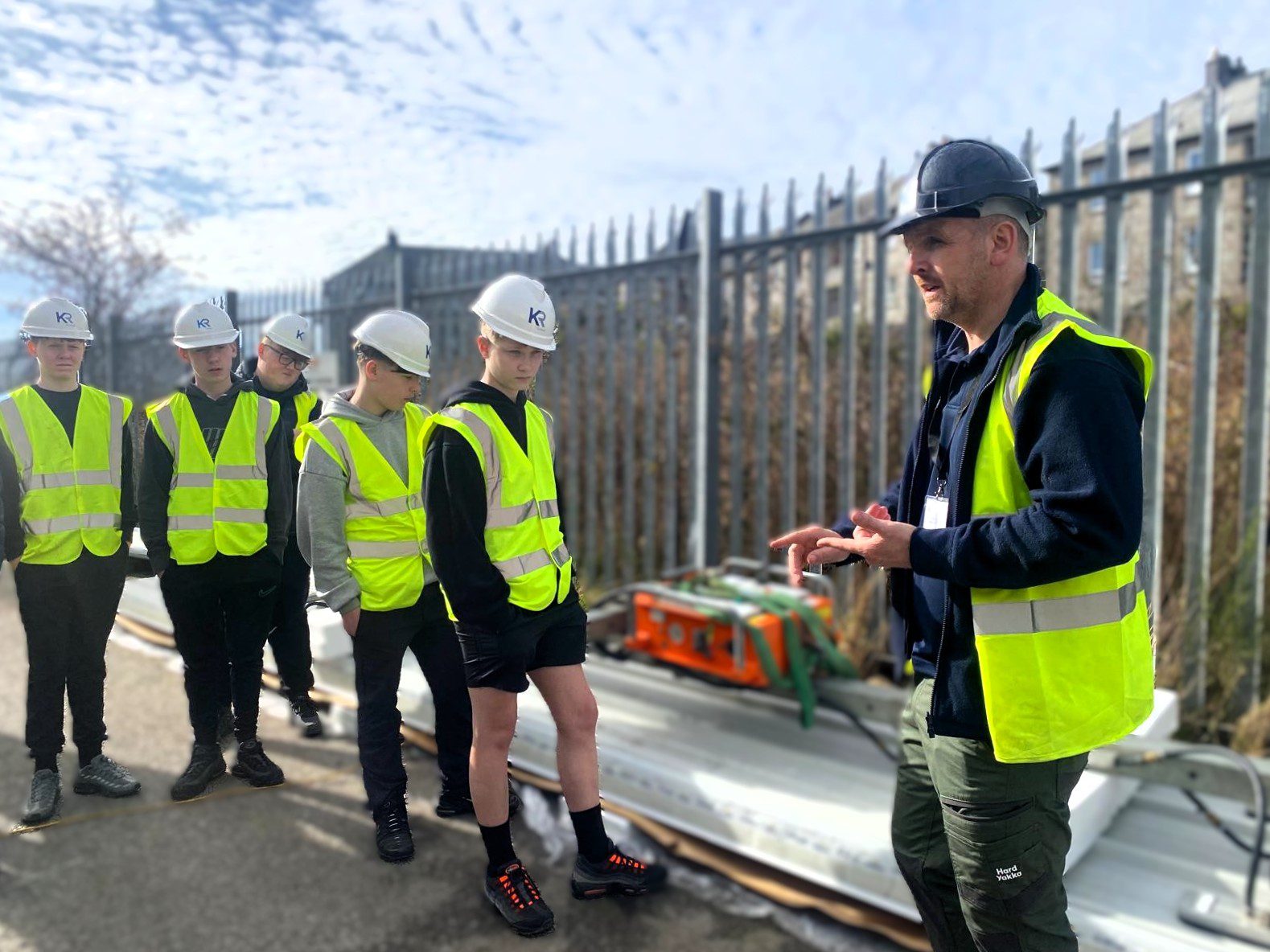 KR Group director, Kenny Robertson showing St Machar Academy students around a KR Group construction site.