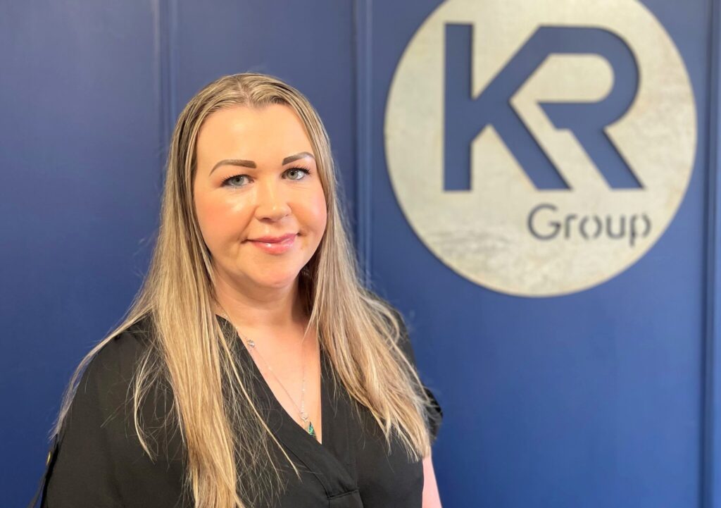 Portrait image of Gayle Roddie, Senior QS at KR Group Scotland standing in the company offices.