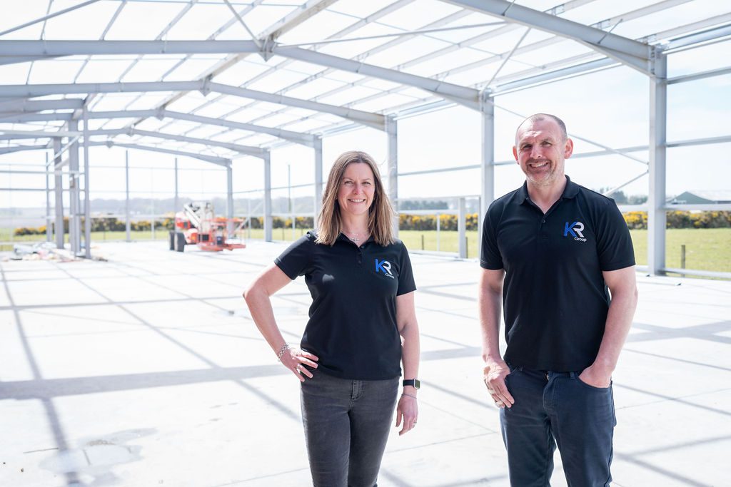 KR Group directors, Nicola Fraser and Kenny Robertson standing in front of a steel frame build in Aberdeenshire.